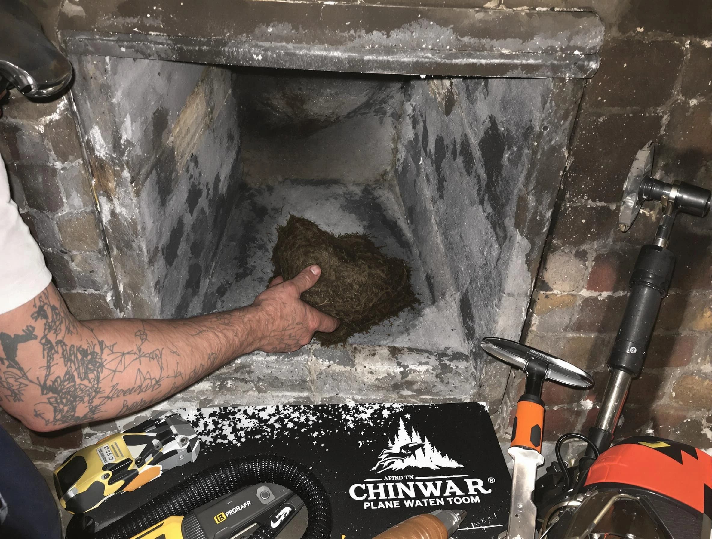 Golden Chimney Sweep safely removing debris and screening chimney in Golden, CO